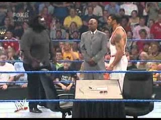 Batista and Mark Henry sign the contract for the Great American Bash   07 14 06   world’s strongest man wwe wrestling batista smackdown Pictures, Batista and Mark Henry